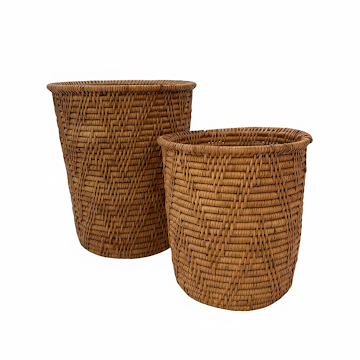 Two woven brown baskets on a white background