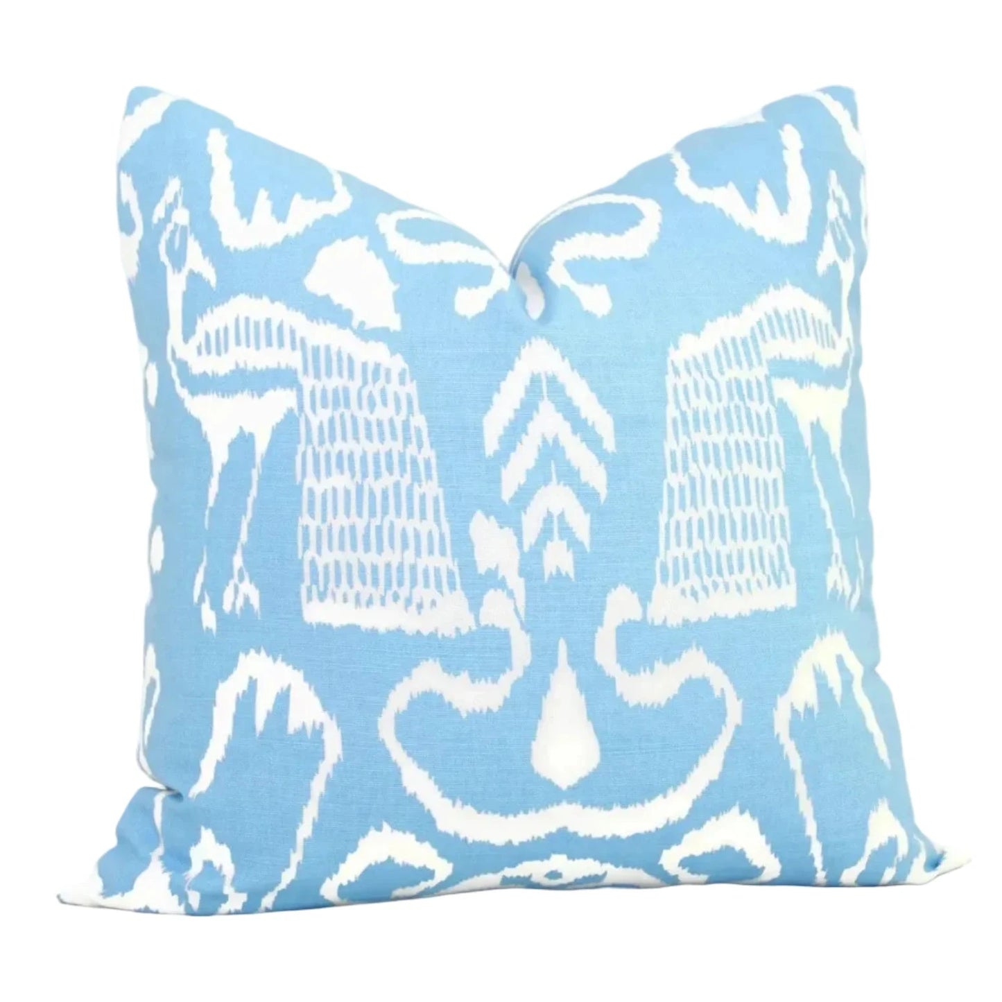 Decorative pillow with white abstract pattern on a light blue background