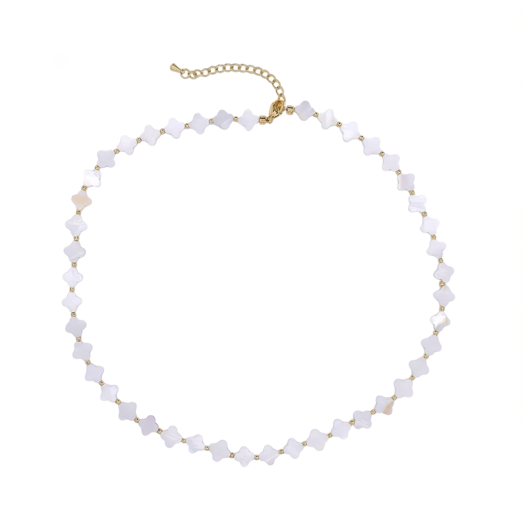 A delicate choker necklace featuring small, faceted white beads set in gold-tone metal, with a gold-tone extender chain at the clasp, displayed on a solid white background.
