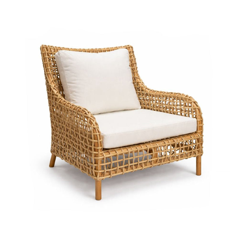 Wicker armchair with white cushions on a white background