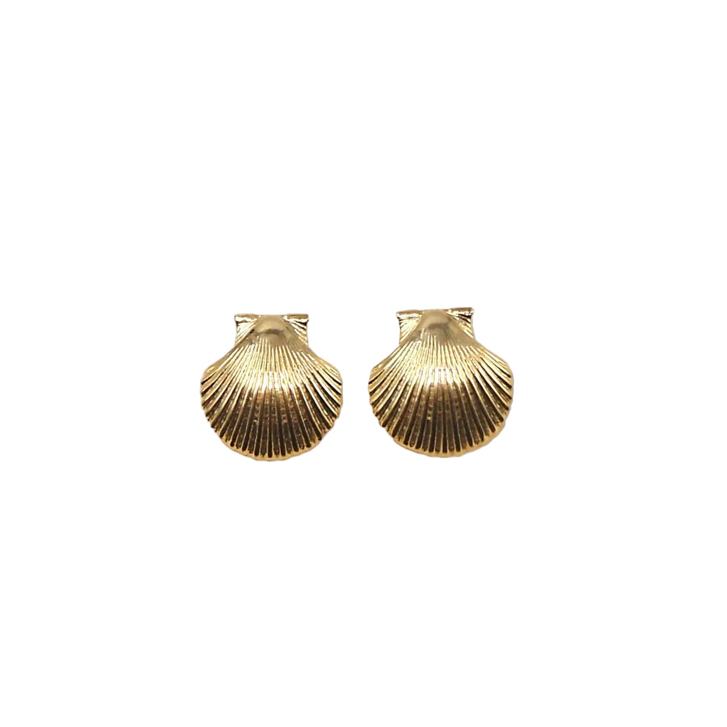 Pair of gold scallop shell earrings on a beige background