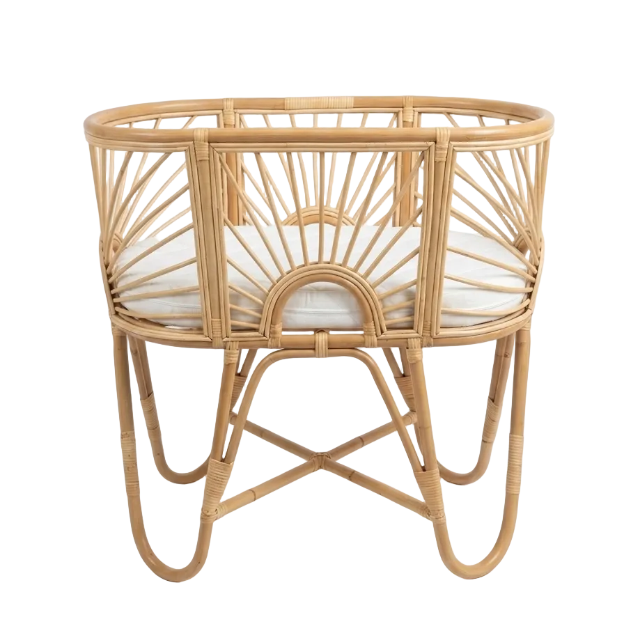 Wicker baby crib on a white background