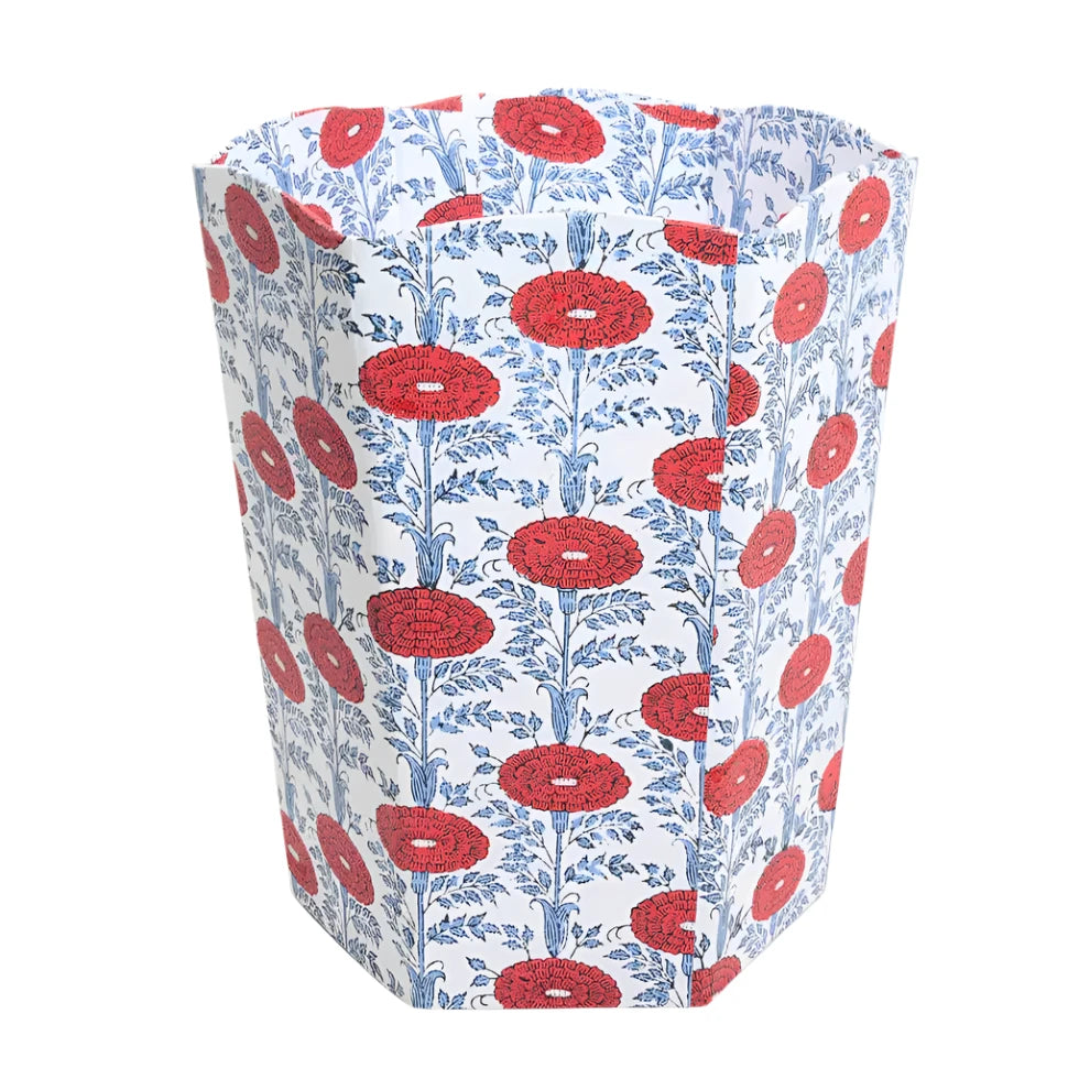 Hexagonal container with red floral pattern on a white background