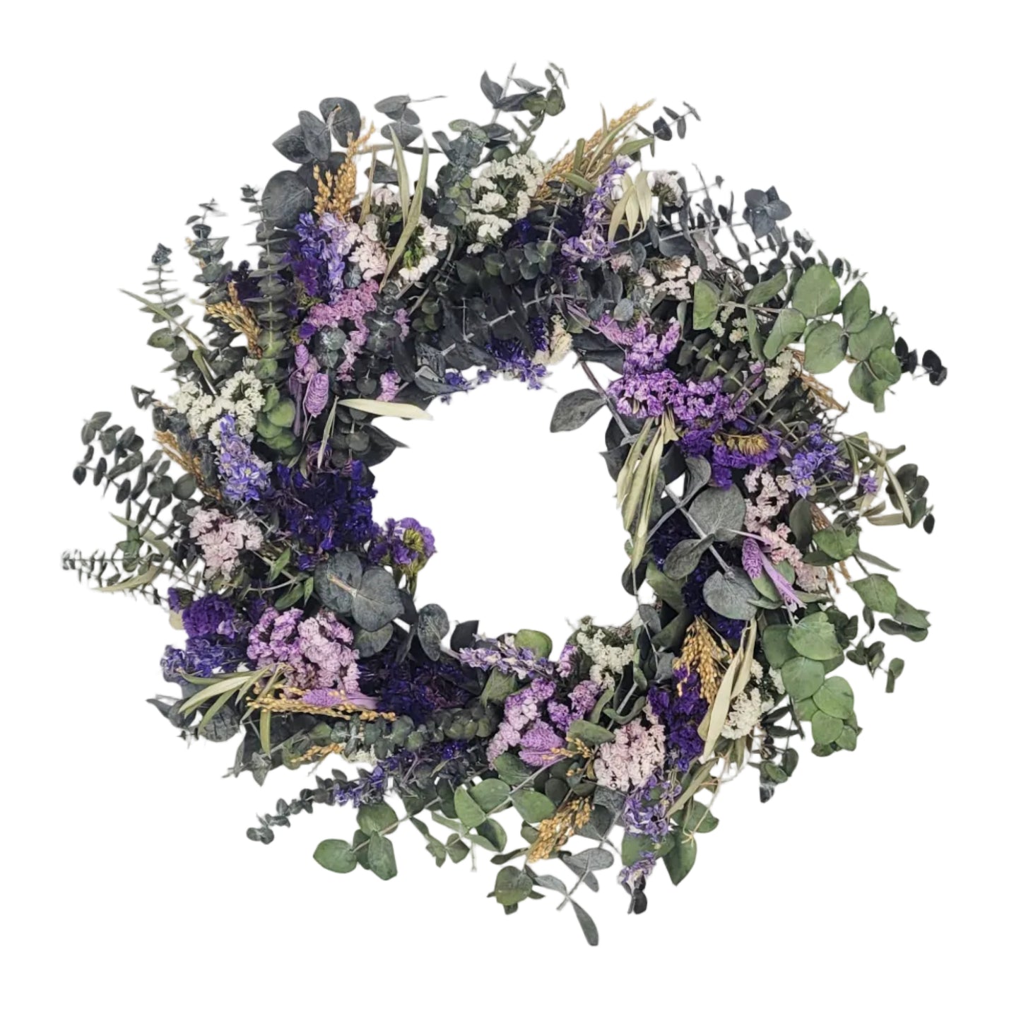 Wreath made of greenery, purple flowers, and eucalyptus on a white background