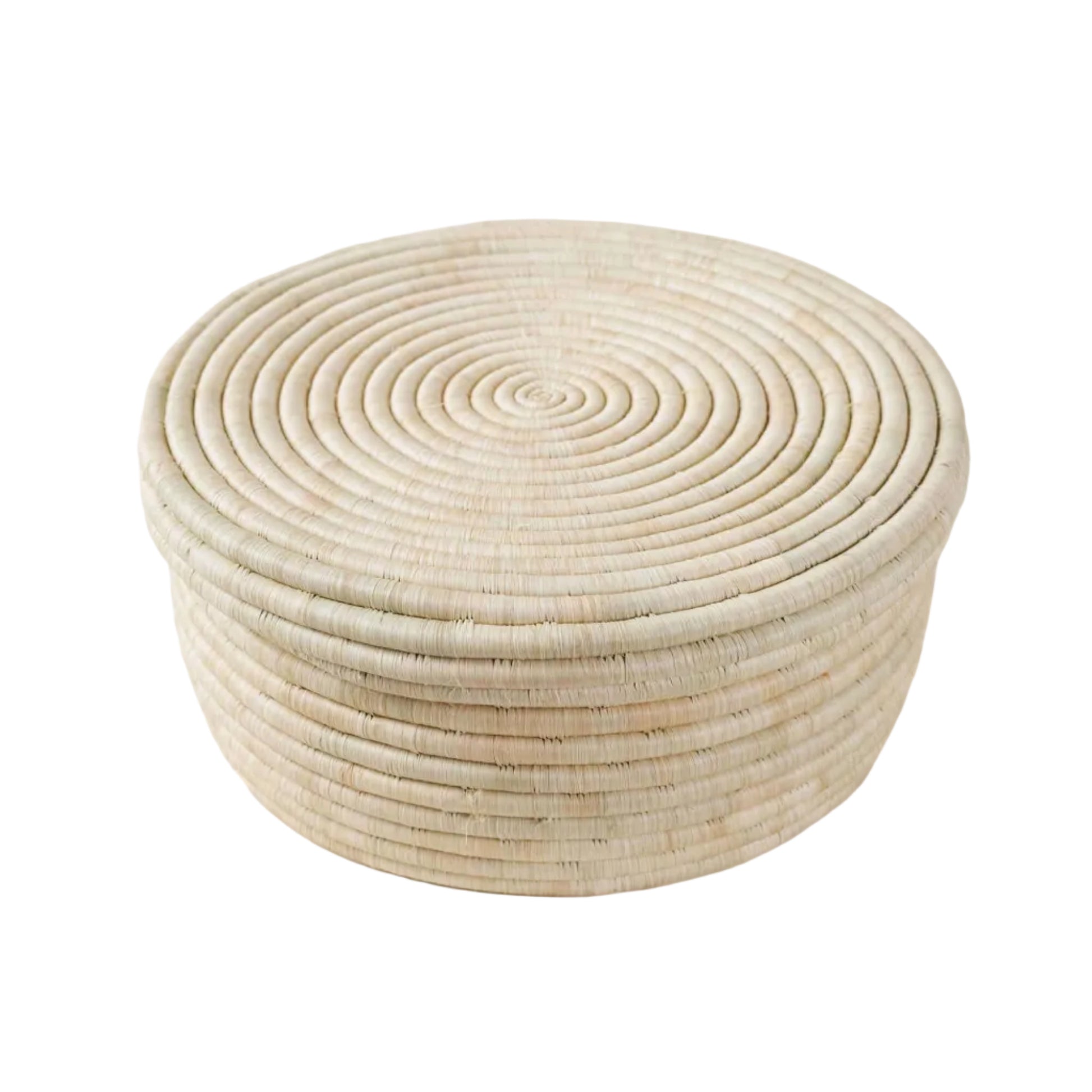 A round woven basket with a spiral pattern, made from natural light beige fibers, set against a solid off-white background.