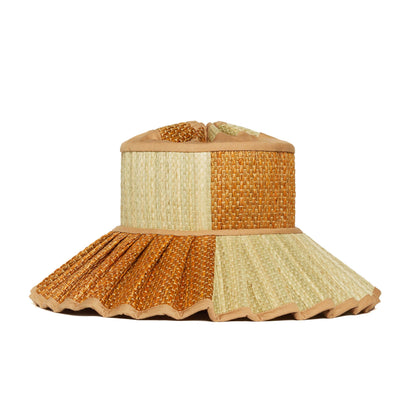 Woven sun hat with a scalloped edge on a white background
