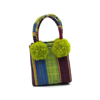 Colorful handbag with green pom-poms on a white background