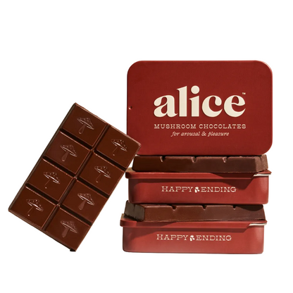 Red chocolate tin labeled 'alice' with a chocolate bar on a beige background