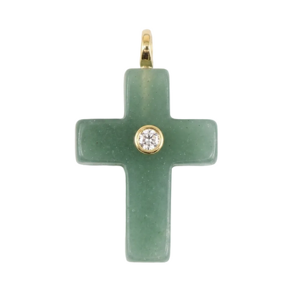 Green cross pendant with a gold setting on a white background