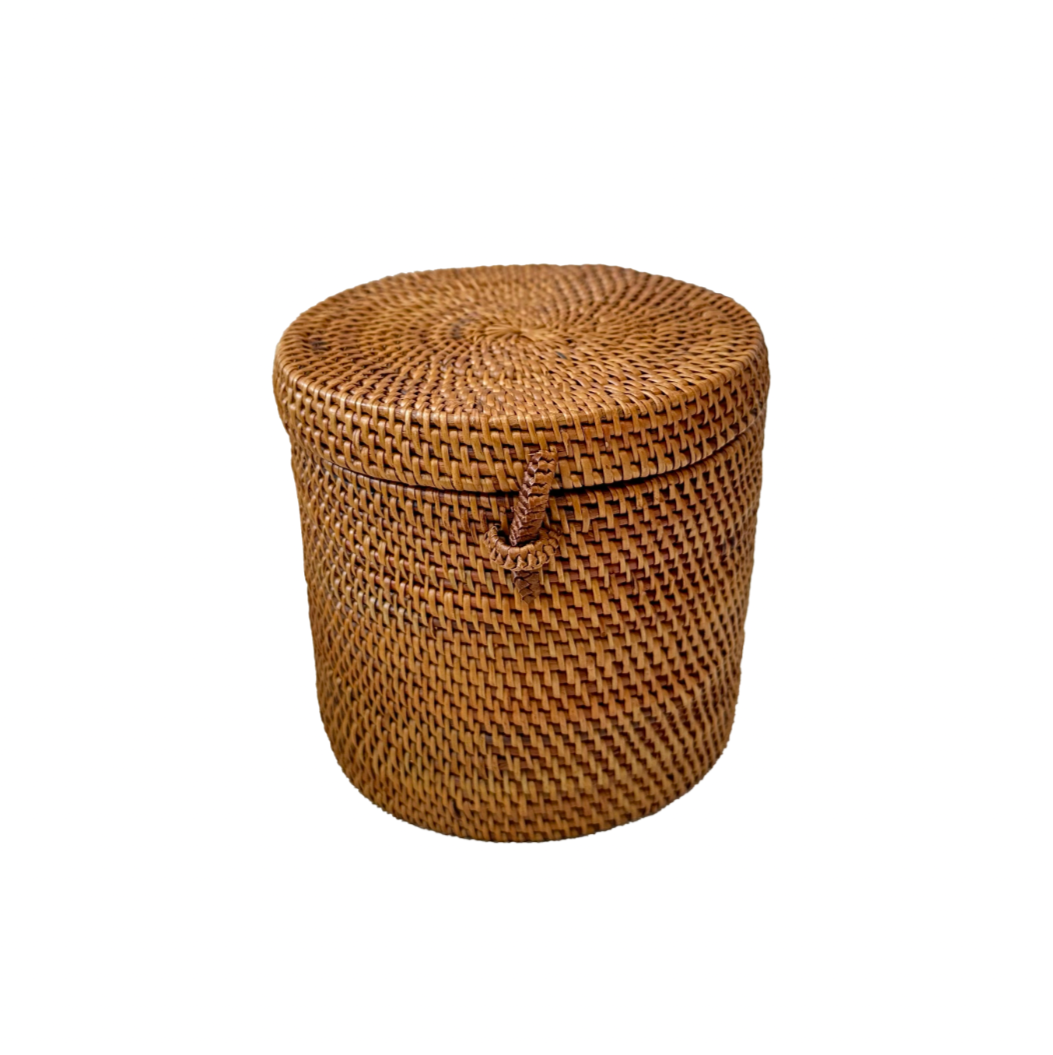 Woven brown basket with a lid on a white background