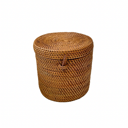 Woven brown basket with a lid on a white background