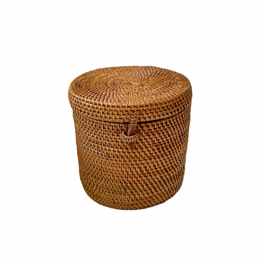 Woven brown basket with a lid on a white background