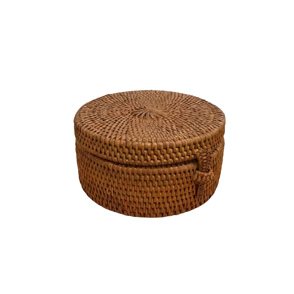 A round woven rattan storage basket with a fitted lid and a side handle, shown on a plain white background.