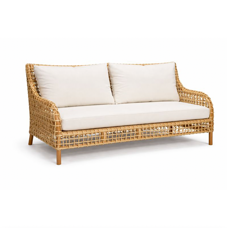 Wicker sofa with white cushions on a white background