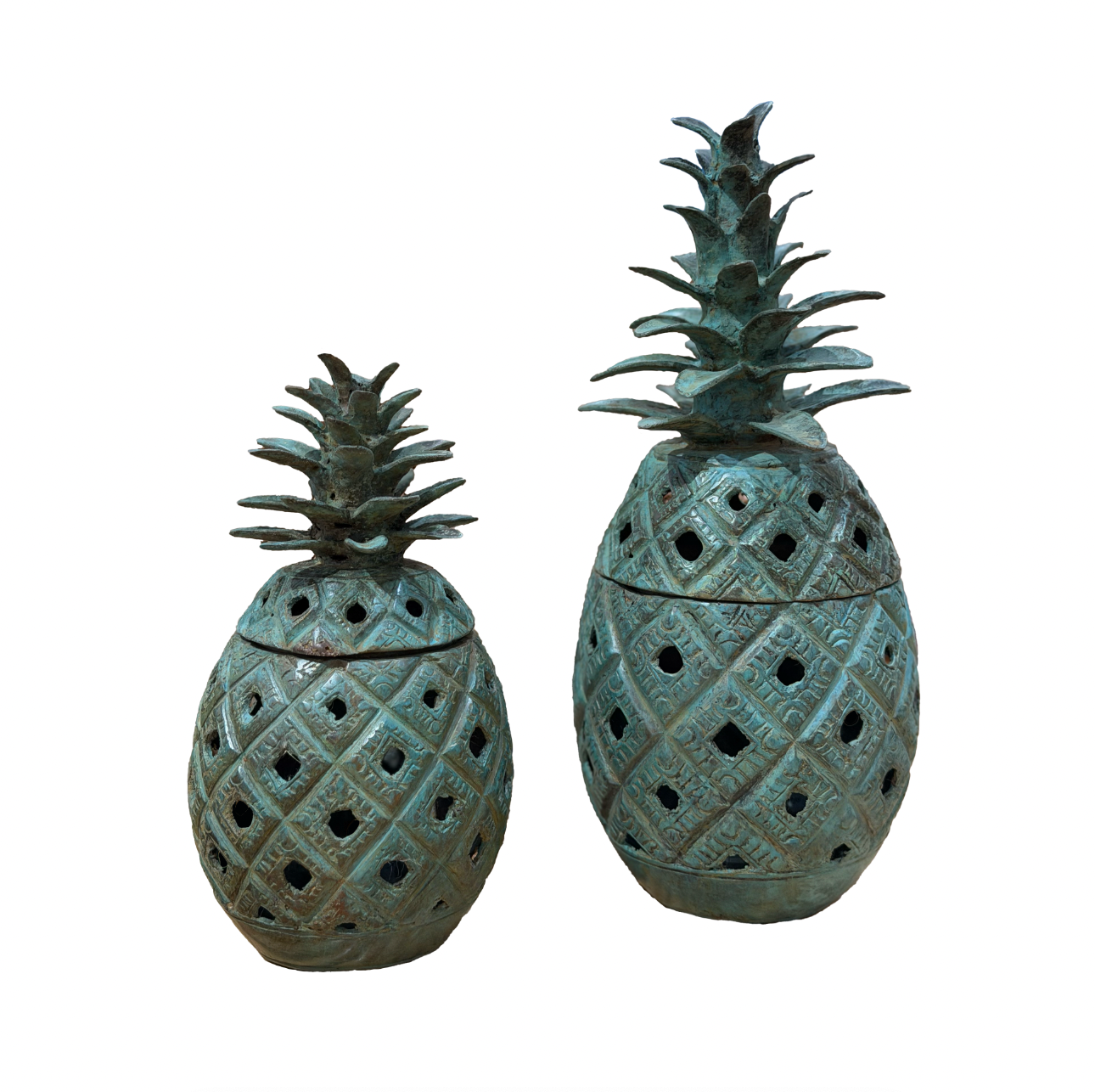 Two decorative pineapple-shaped jars with lattice designs on a white background