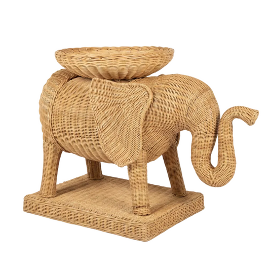 Wicker elephant-shaped stool with a bowl on a white background