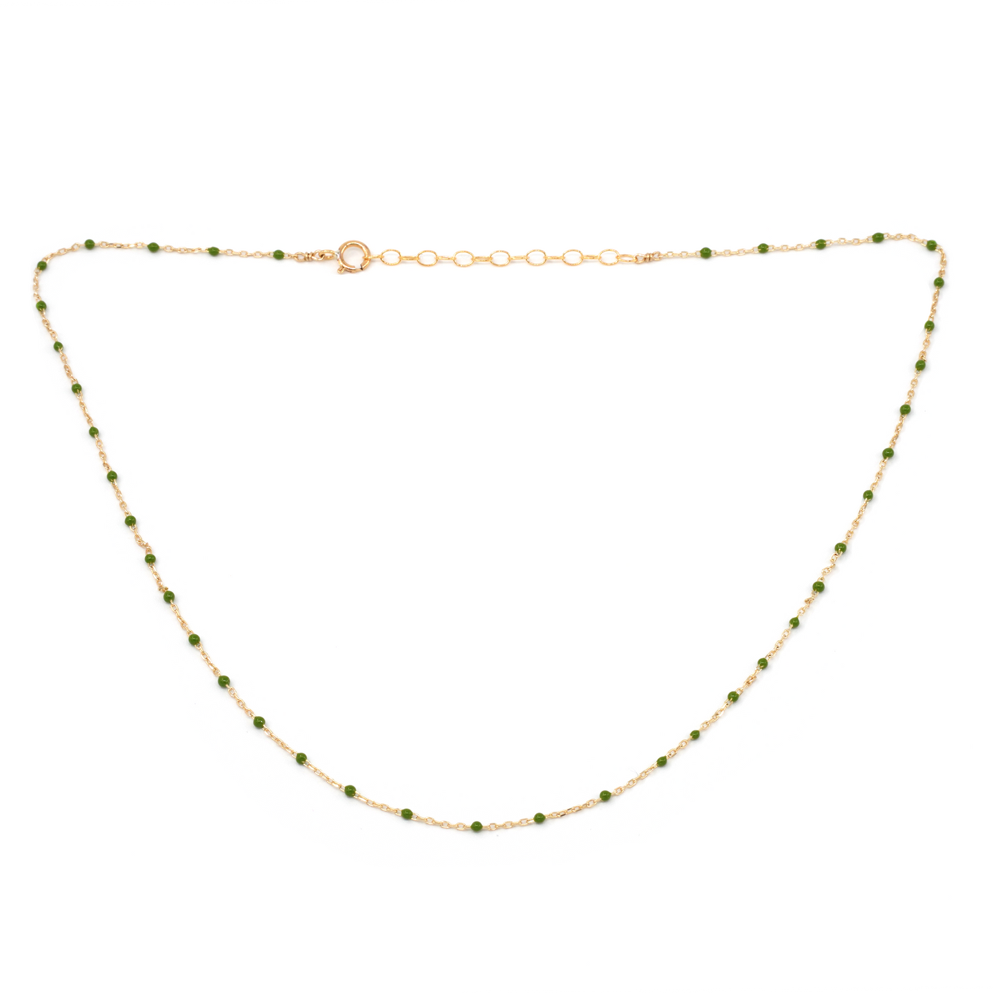 Gold necklace with green beads on a white background