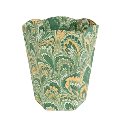 Decorative waste bin with green and gold marbled pattern on a white background