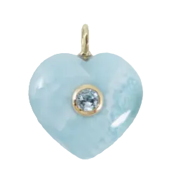 Heart-shaped light blue pendant with a gold and clear gemstone center on a white background