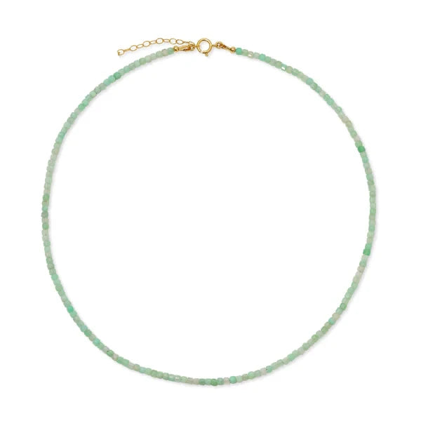 Green beaded necklace with a gold clasp on a white background