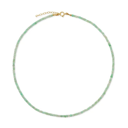Green beaded necklace with a gold clasp on a white background