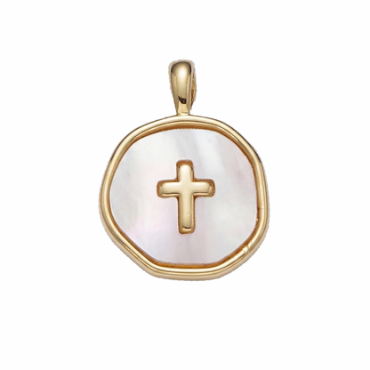 Gold pendant with a cross on a white background