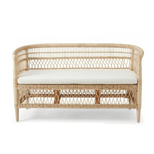 Wicker bench with white cushion on a white background