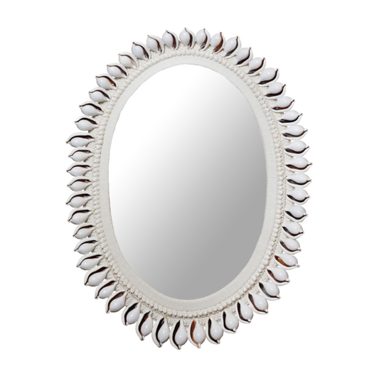Decorative mirror with a shell-like frame on a white background