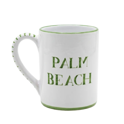 White mug with green text 'PALM BEACH' on a white background