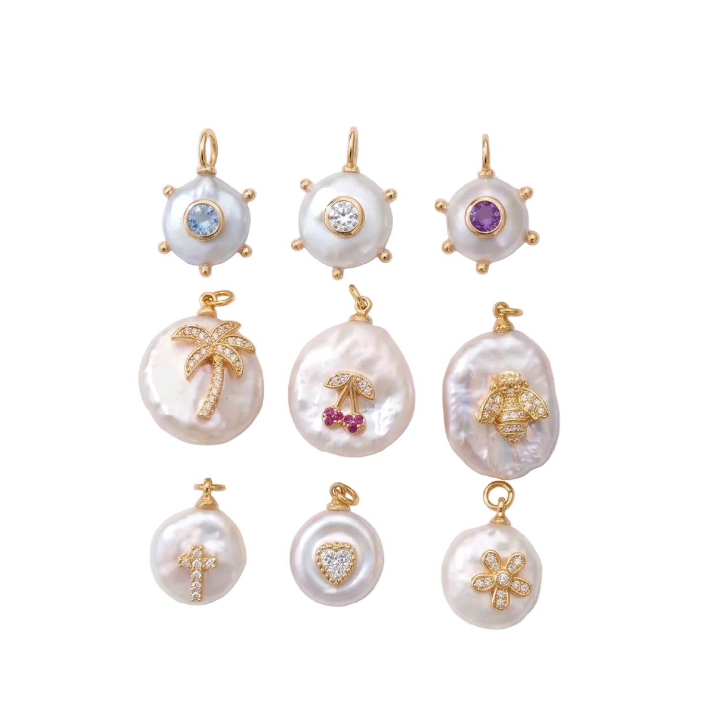 Nine gold and pearl pendants arranged in a 3x3 grid on a white background with soft diagonal shadows. The pendants feature various motifs including a palm tree, cherry, cross, flower, sun, and abstract shapes, embellished with small colored gemstones.