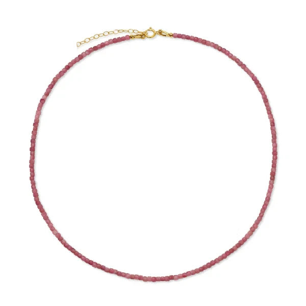 Necklace with pink beads and gold clasp on a white background