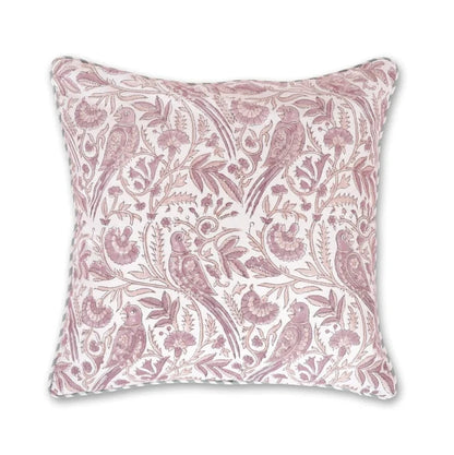 A square decorative throw pillow featuring a dusty pink and white botanical and bird pattern, shown against a plain white background with a blue brand logo in the top-left corner.
