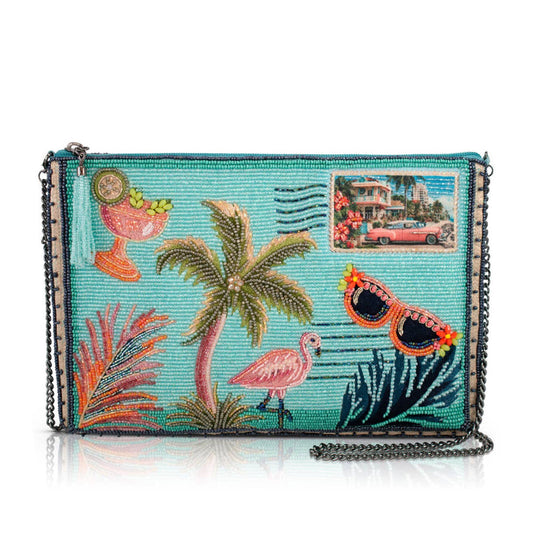 Beaded clutch with tropical design featuring palm trees, flamingos, and a pink car.