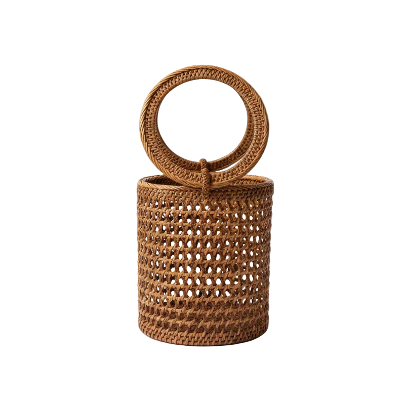 Brown woven handbag with circular handle on a white background