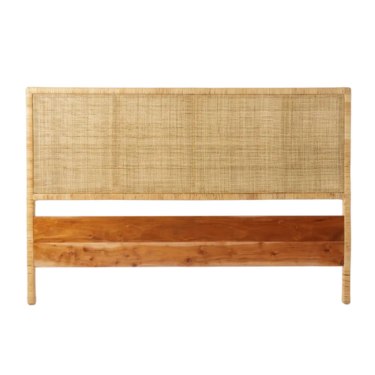 Wooden headboard with woven top section on a white background