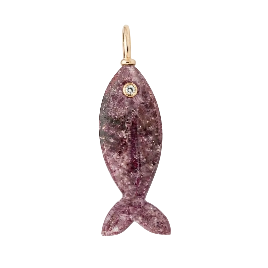 A fish-shaped pendant or charm made of sparkling purple crystal with a small gold loop at the back and a clear stone in the eye, shown on a plain white background.