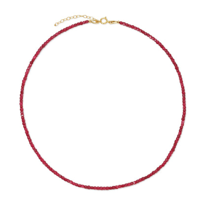 Red beaded necklace with a gold clasp on a white background