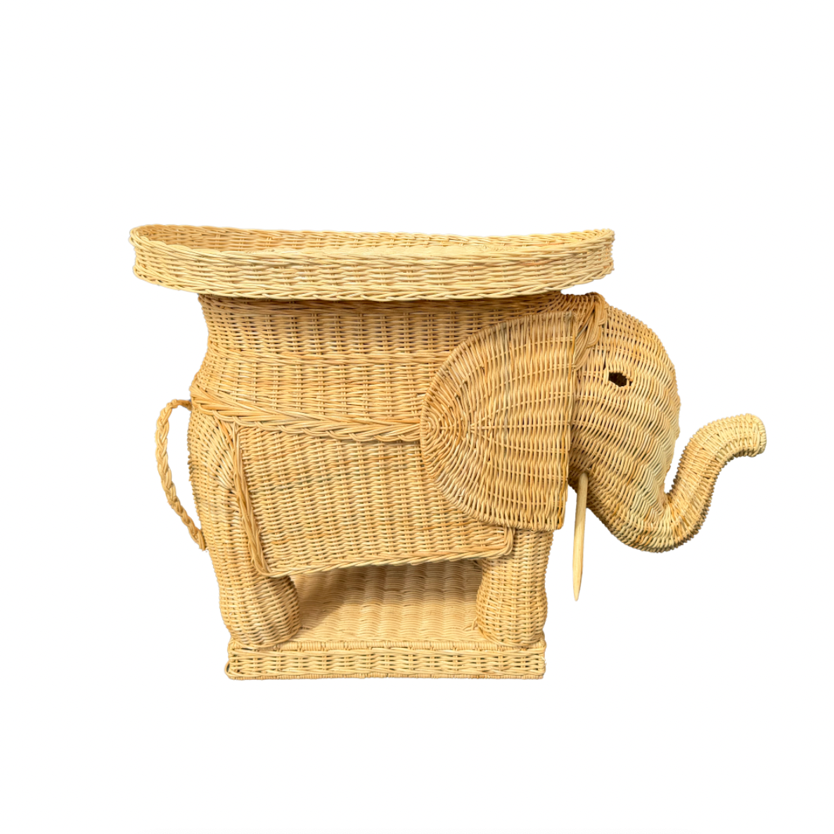 Wicker elephant-shaped side table on a white background