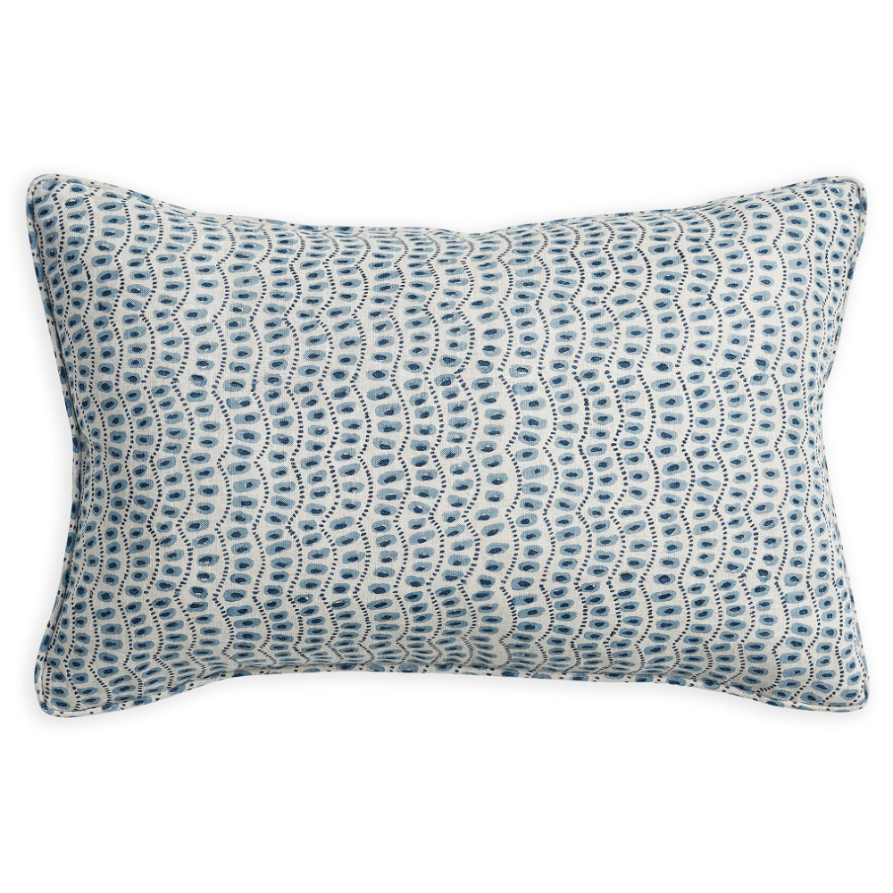 A rectangular lumbar throw pillow featuring a blue and white wavy, scalloped pattern, shown against a plain white background.