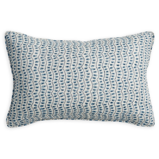 A rectangular lumbar throw pillow featuring a blue and white wavy, scalloped pattern, shown against a plain white background.