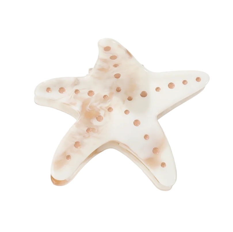 Star-shaped object with polka dots on a white background
