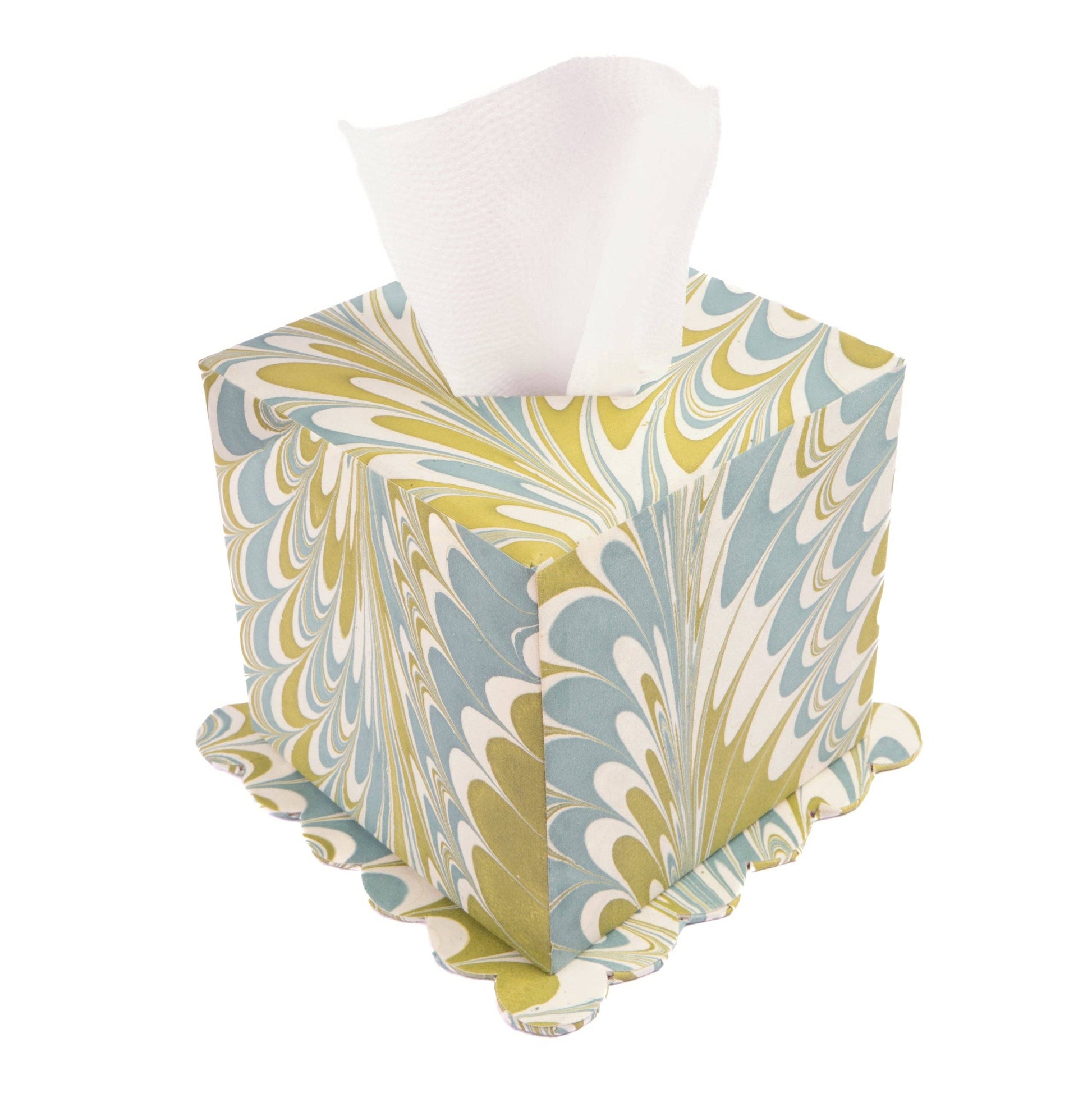 Marbled patterned tissue box cover with tissues on a white background
