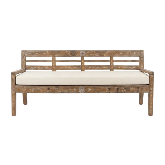 Wooden bench with shell inlay and white cushion on a white background