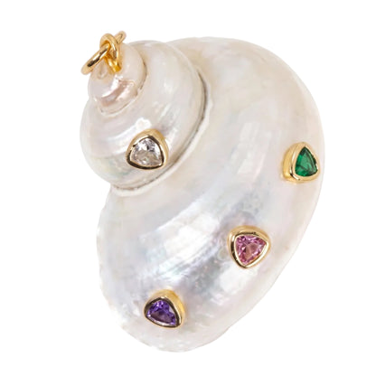A spiral shell-shaped pendant made of iridescent white mother-of-pearl with gold-tone settings and small heart-shaped gemstones in green, pink, purple, and clear, shown on a white background.