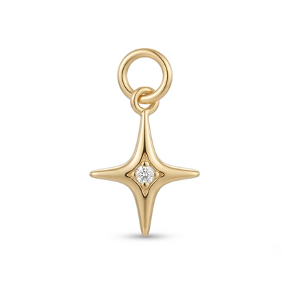 Gold star-shaped pendant with a diamond on a white background