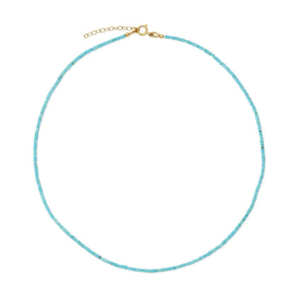 Turquoise beaded necklace with a gold clasp on a white background