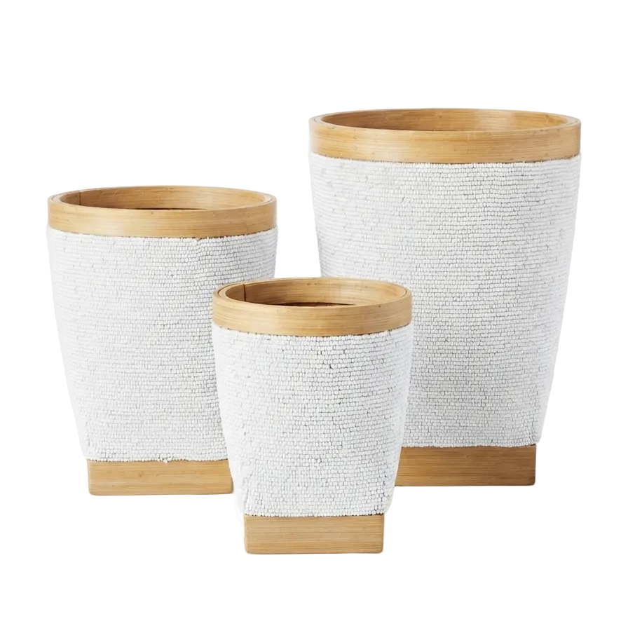 Three woven white planters with natural light wood rims and bases, arranged in a nested set on a white reflective surface.