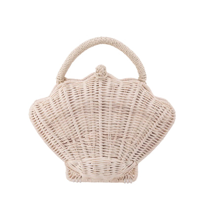 Wicker handbag shaped like a shell on a white background