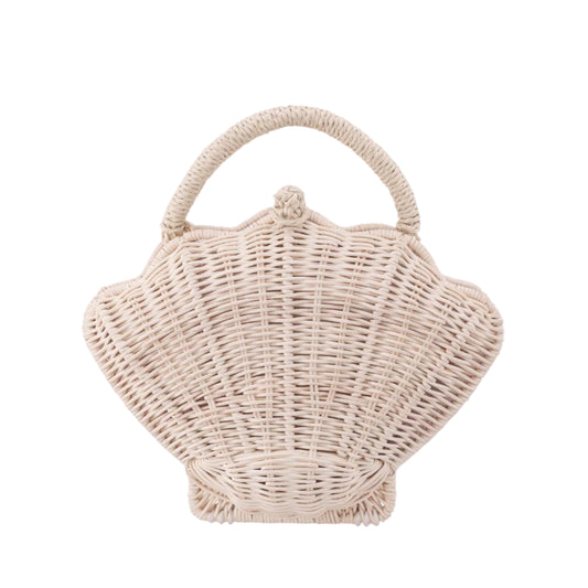 Wicker handbag shaped like a shell on a white background