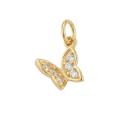 A gold butterfly charm pendant adorned with small clear pavé gemstones, shown on a clean light gray background.